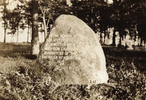 A monument erected to "the memory of our historic dead" erected by the Wau-bun Chapter of the Daughters of the American Revolution in 1915.