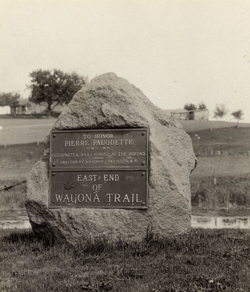 A view of the Pierre Pauquette monument located at the eastern terminus of the Wauona Trail. Erected by the Wau-bun Chapter of the Daughters of the American Revolution, 1925.