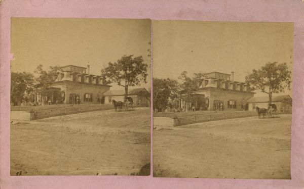 Stereograph of the Purdy house. Angled view from street towards the right side of the house, with a horse-drawn buggy.