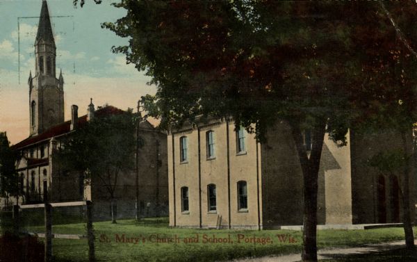 A view of St. Mary's Church and school. Caption reads: "St. Mary's Church and School, Portage, Wis."