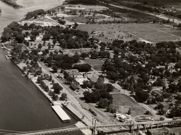Aerial view of town. A bridge over the Mississippi River is in the foreground.