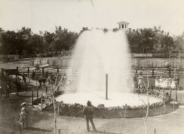 Elevated view of Artesian Well, located near the intersection of Wisconsin Street and South Minnesota Street (since renamed Wacouta). It was dubbed by some to be the "Greatest Artesian Well in America" and was said to possess various medicinal properties.