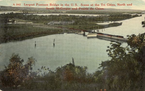 Elevated view of Pontoon Bridge. Caption reads: "Largest Pontoon Bridge in the U.S. Scene at the Tri Cities, North and South McGergor and Prairie du Chien." The original Lawler pontoon bridge was replaced in 1910 by this pontoon bridge.