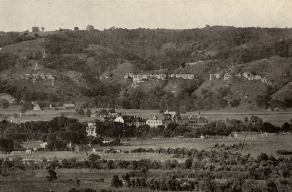 View from a distance of Campion College. Bluffs are in the background.
