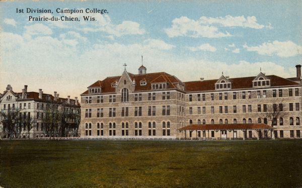 View across grounds towards Campion College. Caption reads: "1st Division, Campion College, Prairie-du-Chien, Wis."