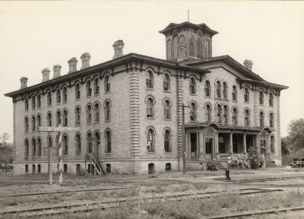 Dousman House Hotel, built in 1863 near the Chicago, Milwaukee and St. Paul Railroad to provide accommodations for its patrons. View looking southeast near the intersection of Water and Fisher Streets.