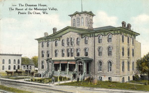 Slightly elevated view of the Dousman House. Caption reads: "The Dousman House. The Resort of the Mississippi Valley, Prairie du Chien, Wisconsin."