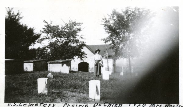 Fort Crawford Military Cemetery, restored by the United States Government about 1905. A woman is standing in the center.