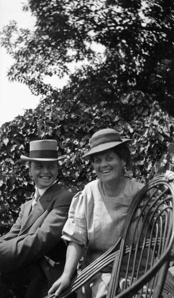 Belle Case La Follette and Alfred T. Rogers photographed in the garden at Maple Bluff Farm in 1907.  During the previous year Rogers became a partner of La Follette's law firm.  In addition to his law practice, Rogers was also a national leader in the Republican Party.