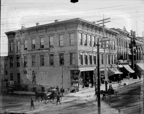 Elevated view of the Fairchild Block at 29 East Main Street as photographed by attorney Albert G. Zimmerman. Until 1894 Zimmerman was a partner in the law firm, La Follette, Harper, Roe, & Zimmerman, but in that year La Follette, Roe, and Zimmerman moved from the Pioneer Block to this building where they occupied adjoining, but independent offices on the second floor. Robert M. La Follette, Sr., continued to practice law in this building until he was elected governor in 1900. Many years later S.S. Kresge occupied the building. Image #30696 which shows the Pioneer Block, in which Zimmerman had previously practiced, was probably also taken by the attorney to document the two locations of his professional offices.