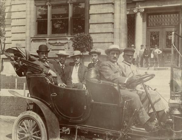 During the 1890s Assemblyman James O. Davidson (on the left, wearing a bowler hat) of Soldiers Grove, was an early supporter of the La Follette wing of the Republican Party.  In 1899 he became state treasurer, and in 1902 Davidson was elected lieutenant governor as the running mate of Robert M. La Follette, Sr.  Davidson became governor on January 1, 1906 when La Follette resigned to become senator.  In the Republican gubernatorial primary election in September 1906, La Follette threw his support to Irvine Lenroot.  Davidson won anyway and was ultimately responsible for enactment of much of the the Progressive legislative program.  In 1910 he chose not to run again, however.  Davidson eventually became allied with the Stalwart wing of the Republican Party.  This photograph shows Governor Davidson shortly after his 1906 electoral success, but the occasion documented is unknown.