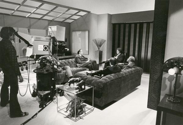 Senator William Proxmire, chairman of the Senate Banking Committee, being interviewed by Lewis Rukeyser and others on the set of the public television program, Wall Street Week.