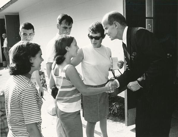 Senator William Proxmire shakes hands with a young constituent at the Wisconsin State Fair. For many years Proxmire's appearance was an institution at the fair.