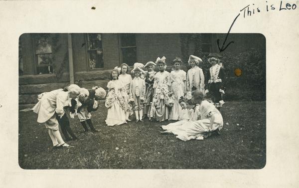 Students of the Kehl School of Dance perform in colonial costumes.  Leo Kehl, the son of the studio founder is wearing the dark costume on the right.