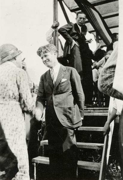 Philip Fox La Follette greets a voter during the 1930 gubernatorial campaign. During this election, La Follette ran as a Progressive Republican, as his father always had. In 1934 Phil and his brother, Robert M. La Follette, Jr., left the Republican Party to form the Progressive Party of Wisconsin.