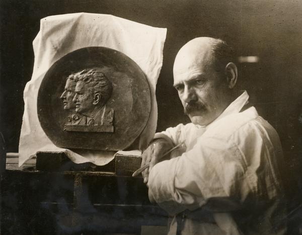 Sculptor Gutzon Borglum at work on his bust of Robert M. La Follette, Sr., and Burton K. Wheeler. The medallion was the official medal of La Follette's Independent Progressive Party Presidential campaign, and small versions of it were presented to party donors.