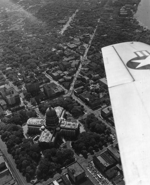 Aerial view of the Wisconsin State Capitol, including a bit of the airplane wing.