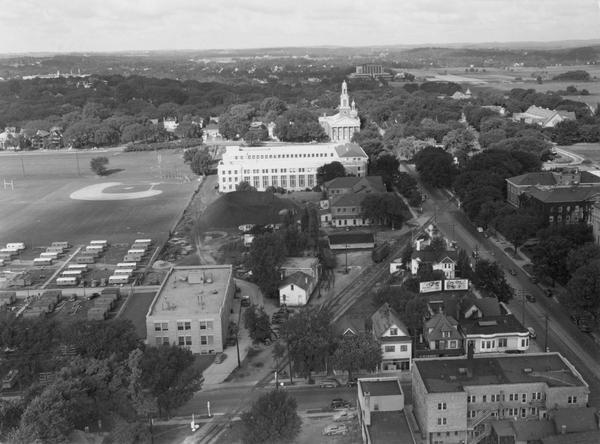 Aerial view of Madison over the University Avenue-Randall Stadium area, looking toward the Congregationalist Church and the U.S. Forest Products Laboratory in the distance.