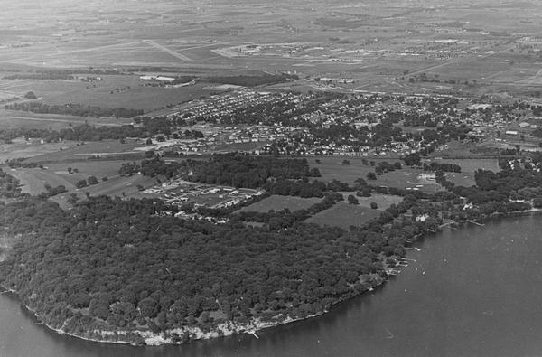Aerial view over the eastern end of Lake Mendota, looking northeast.  Maple Bluff is in the foreground and Truax Field is in the background.
