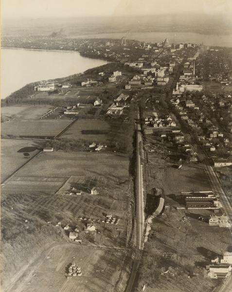 Aerial view of isthmus looking east toward Lake Mendota and the Wisconsin State Capitol, with Lake Monona and the horizon in the background.