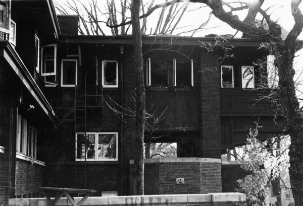 Side view of the Bradley House after the fire of March 17. A portion of the roof is missing.