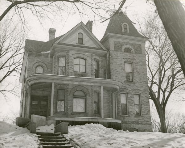 The Butler house at 625 West Lakeside Street with a snow-covered lawn.
