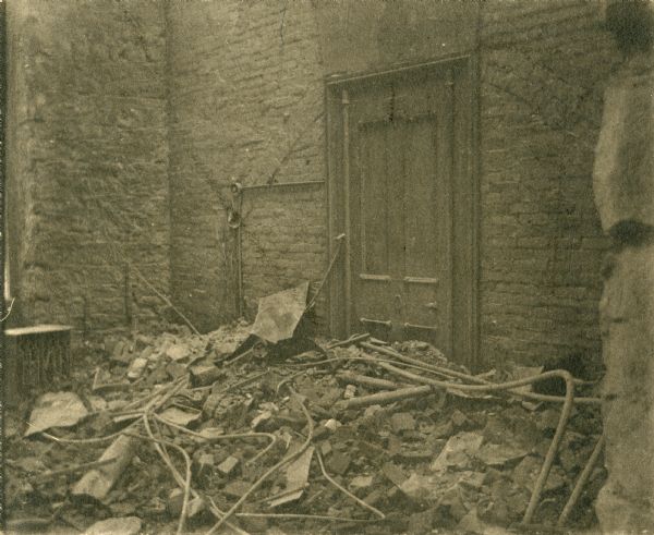 Interior damage to the Wisconsin State Capitol following the fire of 1904. The original photomount had the annotation: "Where my desk stood at the time of the Capitol fire, Feb., 1904."