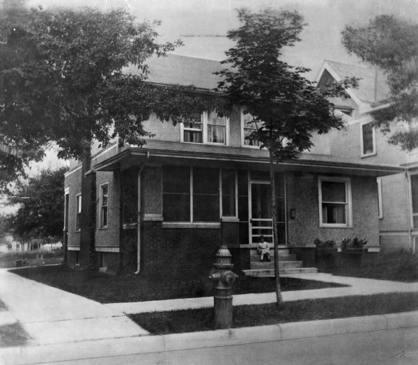The Herman Loftsgordon family residence at 2429 Center Avenue, with daughter Hazel on the steps. Loftsgordon served as chairman of Anchor Savings and Loan Association from 1953 to 1967.