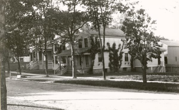 Frederick King Conover residence at 309 North Pinckney Street "as seen from Judge (Harlo S.) Orton's corner," at the intersection of East Johnson Street.  In 1908 the house was moved by William Miller to 647 East Dayton Street.  It has subsequently been designated as a Madison Landmark.