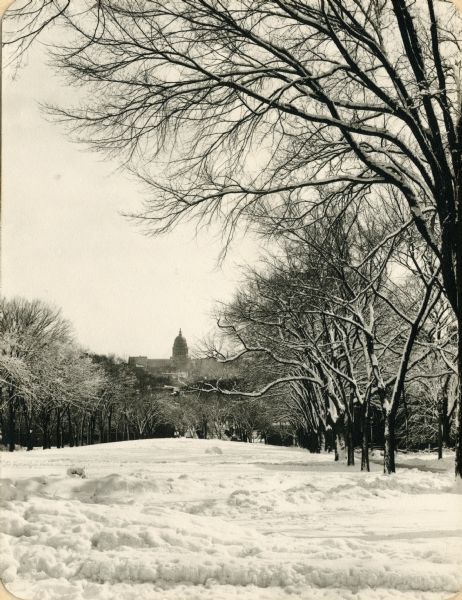 Winter scene of the Wisconsin State Capitol as viewed from the snow-covered Bascom Hill on the University of Wisconsin-Madison campus.
