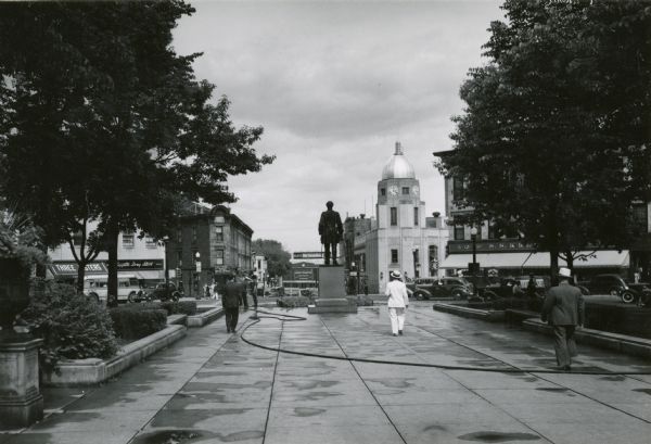 View from the east corner of the Wisconsin State Capitol looking past the Colonel Hans Christian Heg statue with King Street in the background.