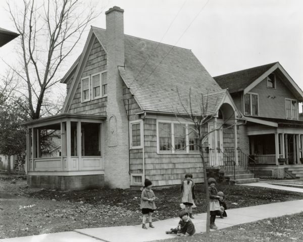 Children play outside the M.J. Purry House, 2125 E. Dayton Street.