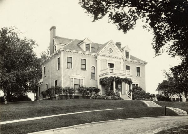 Richard T. Ely residence, 205 North Prospect Street. This house is Georgian revival in style and was built by Richard & Anna Ely in 1896. The architect was Charles Sumner Frost. The Ely family lived there until he moved to Northwestern University. The house, according to Mrs. Anna Ely Morehouse, was one of the very first erected in the University Heights section of the city.