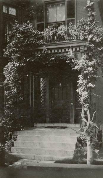 The doorway of the Lucius Fairchild house at 302 South Wisconsin Avenue (renamed Monona Avenue in 1877) near Lake Monona. The house was constructed in 1850 and later substantially altered with additions. After the Civil War, the house became the home of Fairchild's son, Lucius, Civil War hero, Wisconsin governor (1866-72) and foreign diplomat. During his six years as governor, the Fairchild House was the state's executive residence, as no such property was then owned by the state. The residence was therefore a focus of Madison's political and social life during the last half of the 19th century.