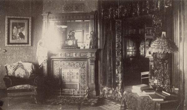 An interior view of the Lucius Fairchild House, showing the sitting room and a partial view of the dining room. The house was constructed in 1850 at 302 South Wisconsin Avenue (renamed Monona Avenue in 1877) near Lake Monona, and was later substantially altered with additions. After the Civil War, the house became the home of Fairchild's son, Lucius, Civil War hero, Wisconsin governor (1866-72) and foreign diplomat. During his six years as governor, the Fairchild House was the state's executive residence, as no such property was then owned by the state. The residence was therefore a focus of Madison's political and social life during the last half of the 19th century.
