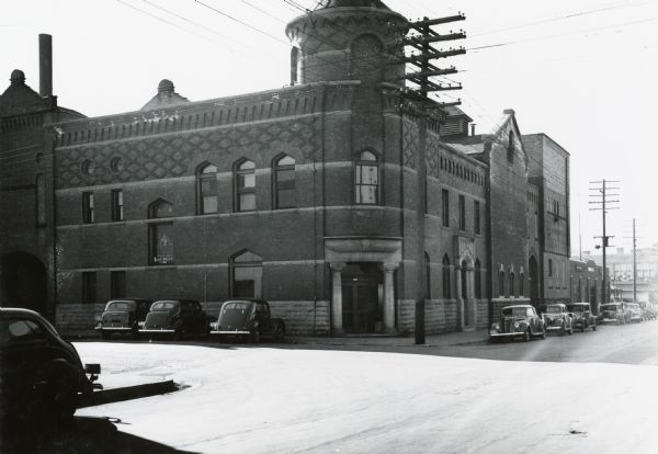 The old Fauerbach Brewery at 651-653 Williamson Street. The corner entrance is flanked by columns.