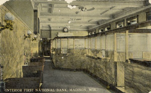 An interior view of the First National Bank. Caption reads: "Interior First National Bank, Madison, Wis."