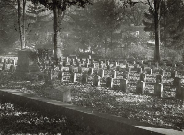 A Confederate Rest at the Forest Hill cemetery, showing the graves of Confederate soldiers who died at Camp Randall as prisoners of war in 1862.  The men were captured at Island 10 on the Mississippi River a few miles south of Cairo, Illinois, in April, 1962.  They arrived in Madison on April 21st, and those who were able were transferred to Camp Douglas by May 30, 1862.  Most of those that died in that short time died of wounds received in the battle in which they were taken as prisoners.