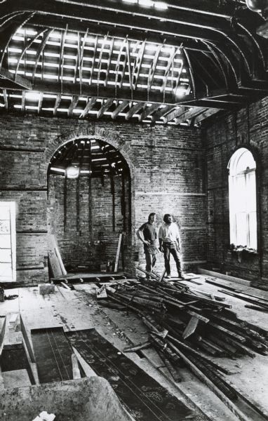Interior of the Gates of Heaven Synagogue at James Madison Park.  Bob Freeman and Jim Harris are inspecting the interior of the structure after it was moved from its original location on the 200 block of West Washingon Avenue between July 16 and 17, 1971.