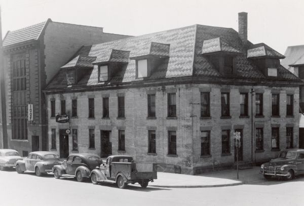 Elevated view of the Hamacher Hotel and Tavern, 302-306 West Mifflin Street, at the intersection of North Henry Street. Its demolition between 1955 and 1956 resulted in the collapse of the neighboring Odd Fellows Hall.