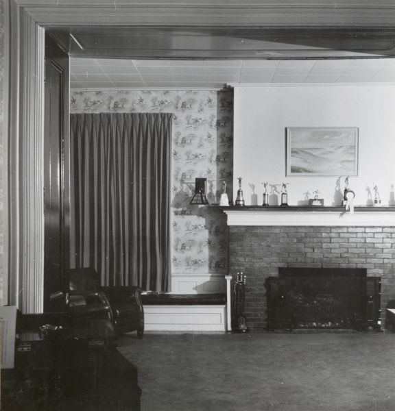 Interior view of a house at 524 North Henry Street, showing the living room used by the Alpha Chi Rho fraternity.