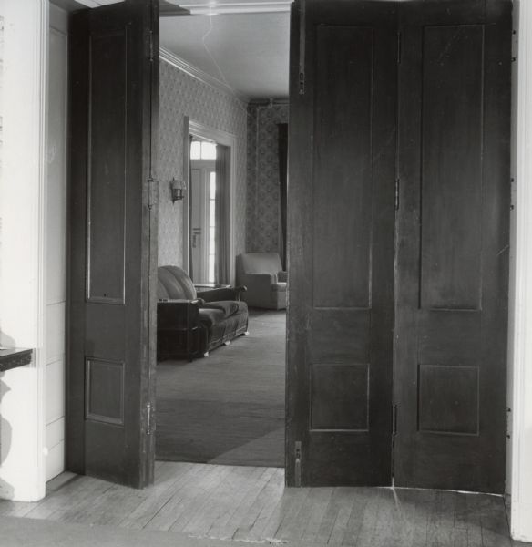 An interior view of a house at 524 North Henry Street, showing the living room from the library.