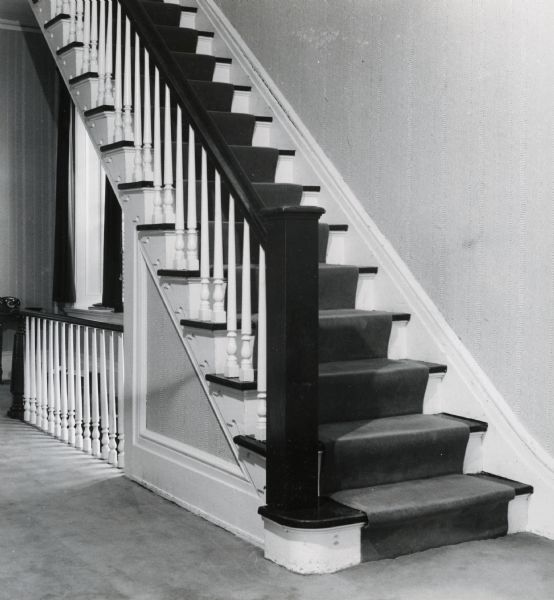 An interior view of the central staircase of the residence at 524 North Henry Street.