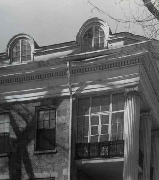 The upper portion of the southeast-facing facade of the house at 524 North Henry Street.