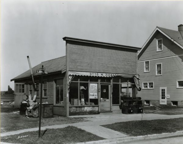 View from street towards the Otto W. ZIebarth Sheet Metal Shop at 2202 East Johnson Street, looking northeast at the intersection of Johnson and North Fourth Streets.