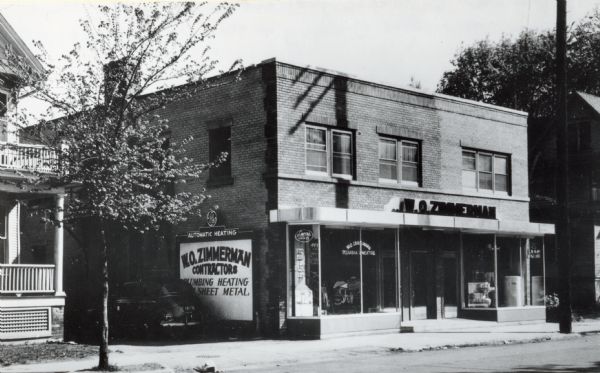 W.O. Zimmerman Plumbing & Heating, 811 East Johnson Street. On the reverse of the original postcard is an invitation to the firm's 18th anniversary and new store opening celebration to be held on May 18, 1949.
