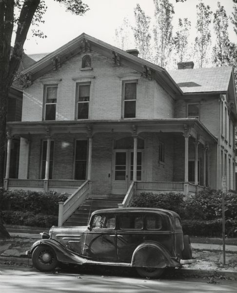 Exterior of house at 4 West Johnson Street, with a car parked in front.