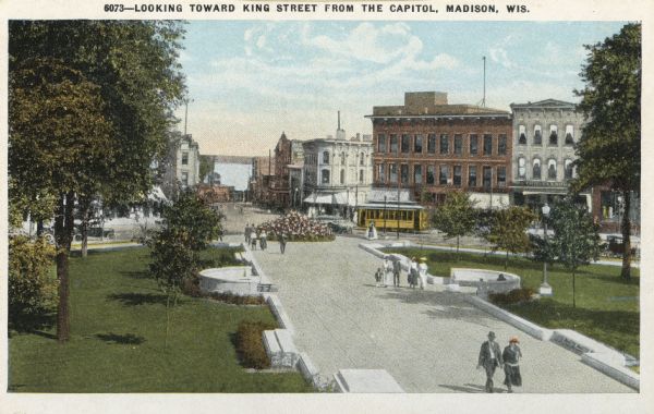 Colorized view of King Street as seen from the Capitol grounds. Caption reads: "Looking Toward King Street from the Capitol, Madison, Wis."