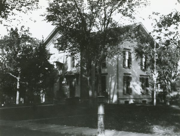 240 Langdon Street, residence of attorney William A.P. Morris.  In 1902 Morris built and moved to a house at 635 Howard Place.  He financed a brick street at the new location and according to the <i>Wisconsin State Journal</i>, (June 6, 1900), erected several "strictly modern cottages for the accomodation and enjoyment of tenants of moderate means but discriminating taste."