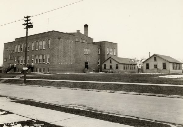 Lowell School from Maple Street with heated barracks to relieve congestion.